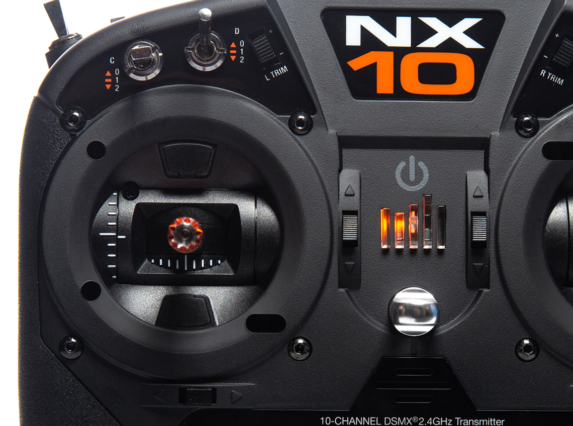 An NX10 photo depicting the transmitter gimbles and front-facing switches.